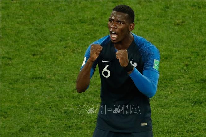 Trong ảnh: Niềm vui của cầu thủ Paul Pogba sau chiến thắng của Pháp trước Bỉ trong trận Bán kết World Cup 2018 tại Saint Petersburg, Nga ngày 10/7. Ảnh: AFP/TTXVN