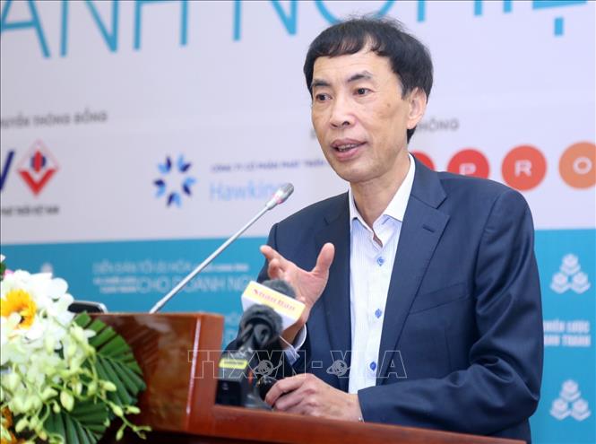 Trong ảnh: Tiến sỹ Võ Trí Thành trình bày tham luận tại diễn đàn. Ảnh: Trần Việt - TTXVN