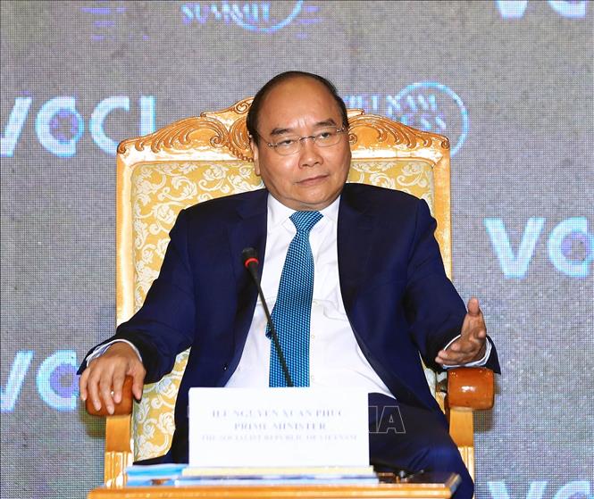 Trong ảnh: Thủ tướng Nguyễn Xuân Phúc đối thoại với các doanh nghiệp tham dự VBS 2018. Ảnh: Thống Nhất – TTXVN