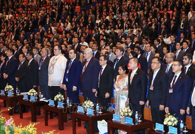 Photo: Delegates during the flag-saluting ceremony. VNA Photo