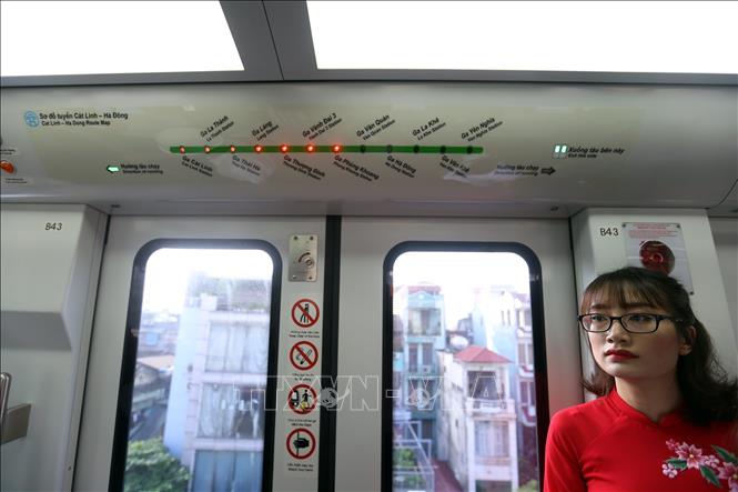 Photo: A train’s door with the route itinerary above during the trial operation. VNA Photo: Huy Hùng
