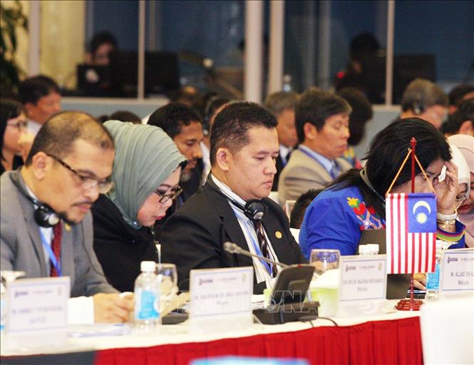 Photo: The delegation of the National Audit Department of Malaysia at the 7th symposium. VNA Photo