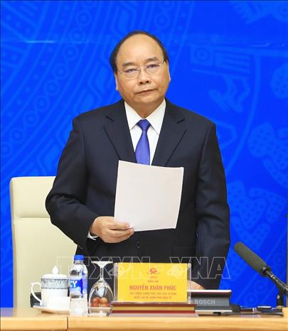 Photo: Prime Minister Nguyen Xuan Phuc speaks at the meeting. VNA Photo: Thống Nhất 