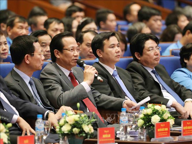 Trong ảnh: Bộ trưởng Bộ Lao động-Thương binh và Xã hội Đào Ngọc Dung (thứ hai từ trái sang) trả lời về vấn đề đào tạo lao động. Ảnh: TTXVN