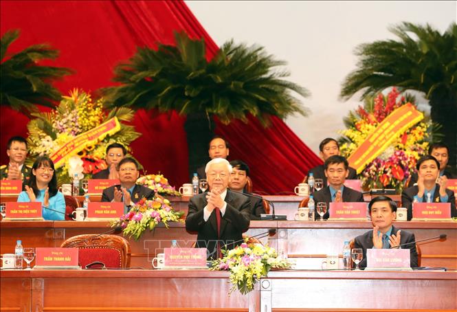 Trong ảnh: Tổng Bí thư Nguyễn Phú Trọng đến dự và tham gia Đoàn Chủ tịch Đại hội. Ảnh: Trọng Đức - TTXVN