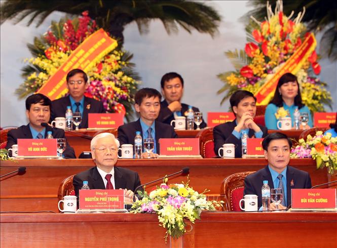 Trong ảnh: Tổng Bí thư Nguyễn Phú Trọng đến dự và tham gia Đoàn Chủ tịch Đại hội. Ảnh: Trọng Đức - TTXVN