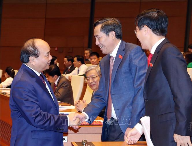 Trong ảnh: Thủ tướng Nguyễn Xuân Phúc và các đại biểu dự Kỳ họp thứ sáu, Quốc hội khóa XIV. Ảnh: Thống Nhất – TTXVN
