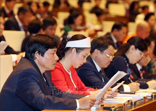 Trong ảnh: Các đại biểu tại Phiên khai mạc Kỳ họp thứ sáu, Quốc hội khóa XIV. Ảnh: Thống Nhất – TTXVN
