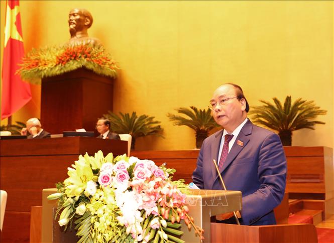 Trong ảnh: Thủ tướng Chính phủ Nguyễn Xuân Phúc trình bày Báo cáo về tình hình kinh tế - xã hội năm 2018 và kế hoạch phát triển kinh tế - xã hội năm 2019. Ảnh: Trọng Đức - TTXVN