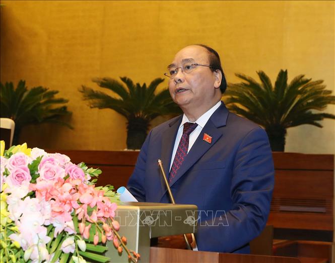 Trong ảnh: Thủ tướng Chính phủ Nguyễn Xuân Phúc trình bày Báo cáo về tình hình kinh tế - xã hội năm 2018 và kế hoạch phát triển kinh tế - xã hội năm 2019. Ảnh: Thống Nhất – TTXVN