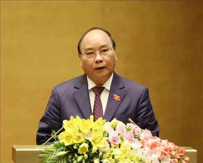 Trong ảnh: Thủ tướng Chính phủ Nguyễn Xuân Phúc trình bày Báo cáo về tình hình kinh tế - xã hội năm 2018 và kế hoạch phát triển kinh tế - xã hội năm 2019. Ảnh: Phương Hoa - TTXVN