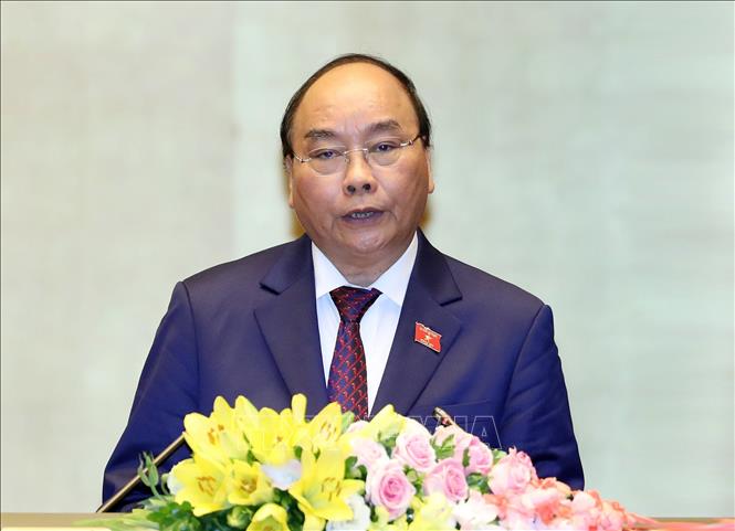 Trong ảnh: Thủ tướng Chính phủ Nguyễn Xuân Phúc trình bày Báo cáo về tình hình kinh tế - xã hội năm 2018 và kế hoạch phát triển kinh tế - xã hội năm 2019. Ảnh: Thống Nhất – TTXVN
