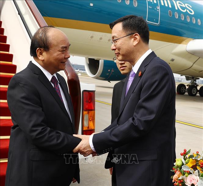 Trong ảnh: Lễ đón Thủ tướng Nguyễn Xuân Phúc  tại sân bay Hồng Kiều, Thượng Hải. Ảnh: Thống Nhất - TTXVN