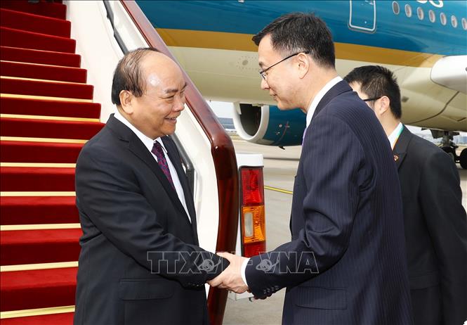 Trong ảnh: Lễ đón Thủ tướng Nguyễn Xuân Phúc  tại sân bay Hồng Kiều, Thượng Hải. Ảnh: Thống Nhất – TTXVN
