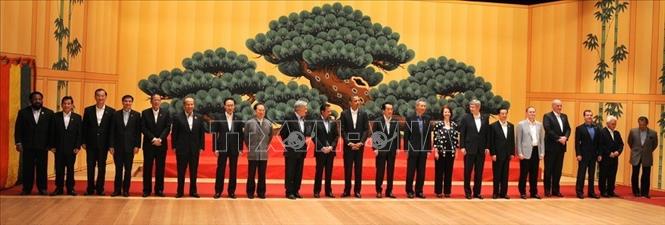 Trong ảnh: Chủ tịch nước Nguyễn Minh Triết với các trưởng đoàn dự Hội nghị Cấp cao APEC lần thứ 18 tại thành phố Yokohama (Nhật Bản), năm 2010. Ảnh: Nguyễn Khang - TTXVN