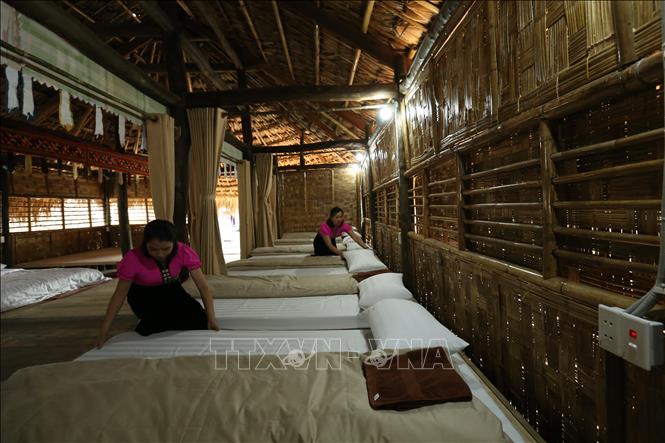 Trong ảnh: Nhà cộng đồng trong khu Homestay Mường Then. Ảnh: Tuấn Anh - TTXVN
