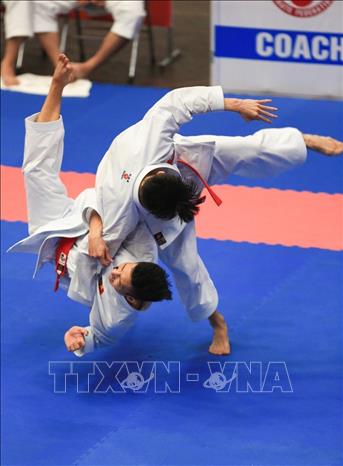 Trong ảnh: Các VĐV đoàn Ninh Bình thi đấu ở nội dung Kata (biểu diễn) đồng đội nam. Ảnh: Trọng Đạt – TTXVN