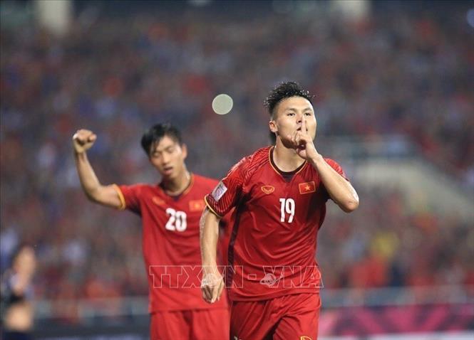 Photo: Number 19 Quang Hai celebrates after scoring the first goal for Vietnam at the 83rd minute. VNA Photo: Trọng Đạt