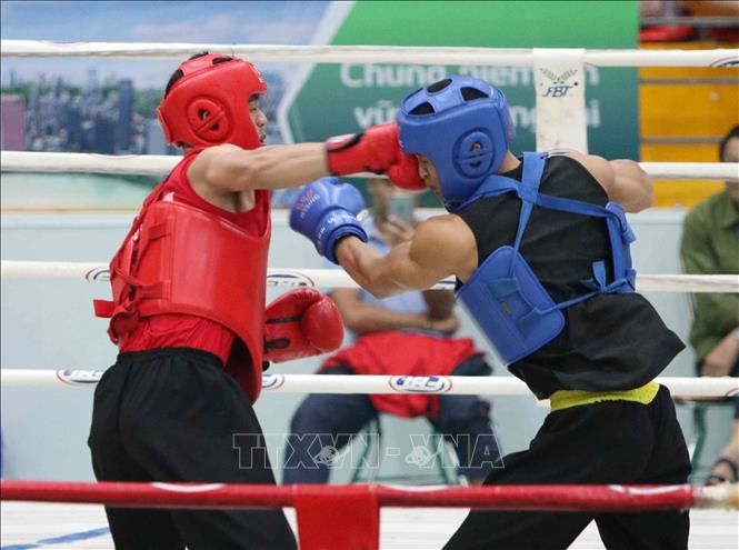 Trong ảnh: Trận chung kết đối kháng môn Võ cổ truyền ở hạng cân 70kg nam giữa VĐV Trương Văn Hải (TP Hồ Chí Minh, giáp đỏ) và VĐV Nguyễn Văn Tư (Bình Dương, giáp xanh) với chiến thắng thuộc về Nguyễn Văn Tư. Ảnh: Văn Điệp – TTXVN