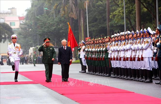 Trong ảnh: Tổng Bí thư, Chủ tịch nước Nguyễn Phú Trọng, Bí Thư Quân ủy Trung ương duyệt đội danh dự. Ảnh: Dương Giang – TTXVN