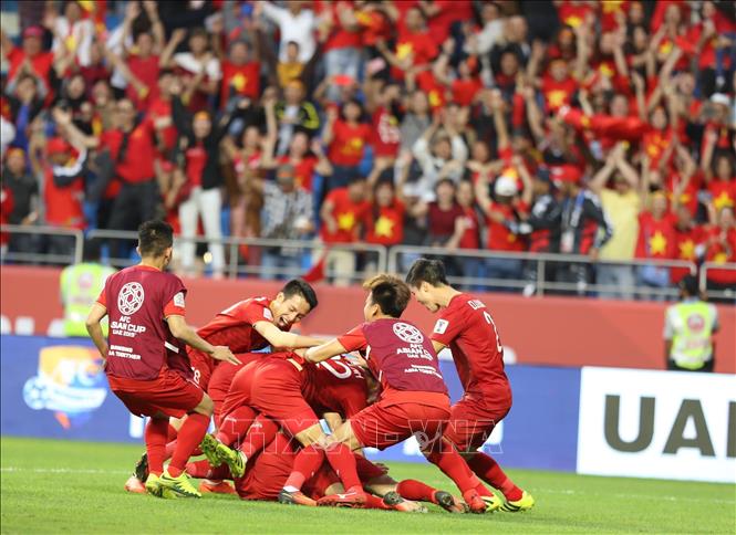 Photo: Vietnamese players celebrate the victory after a breath-taking shootout with Jordan. VNA Photo: Hoàng Linh
