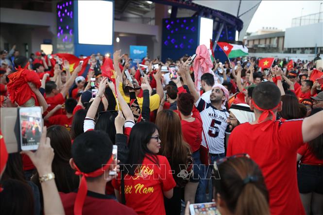 Photo: Vietnamese fans at UAE celebrate after the victory. VNA Photo: Hoàng Linh