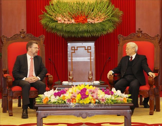 Photo: Party General Secretary and State President Nguyen Phu Trong (R) receives President of the Senate of Australia Scott Ryan. VNA Photo: Trí Dũng
