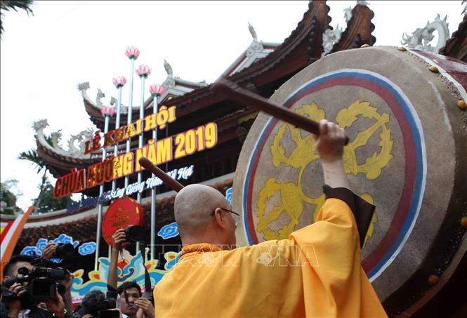 Photo: Huong Pagoda's Abbot Thich Minh Hien beats the drum to open Huong Pagoda Festival. VNA Photo: Thanh Tùng