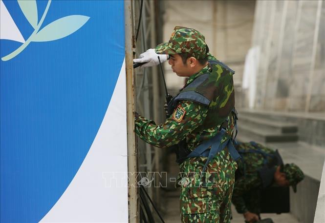 Photo: Sappers make safety checks at places where the activities within the second US-DPRK summit will take place. VNA Photo: Dương Giang 