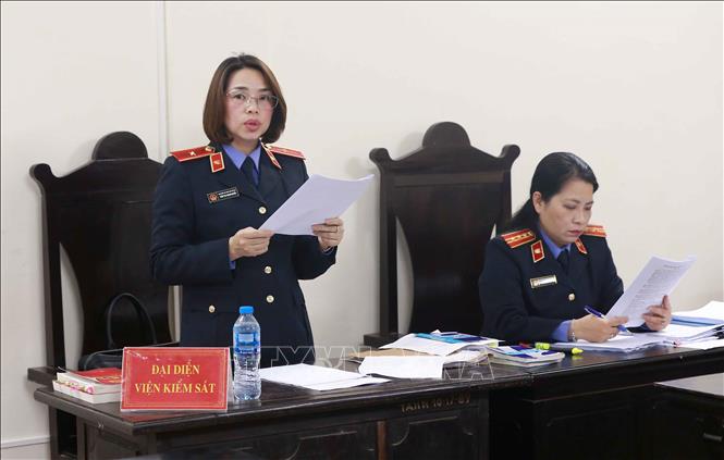 Trong ảnh: Đại diện viện kiểm sát nhân dân TP Hà Nội đọc bản cáo trạng truy tố các bị cáo. Ảnh: Doãn Tấn - TTXVN