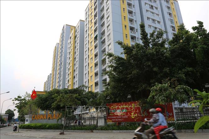 Trong ảnh: Chung cư Carina Plaza sau 1 năm xảy ra vụ hỏa hoạn. Ảnh: Thanh Vũ - TTXVN