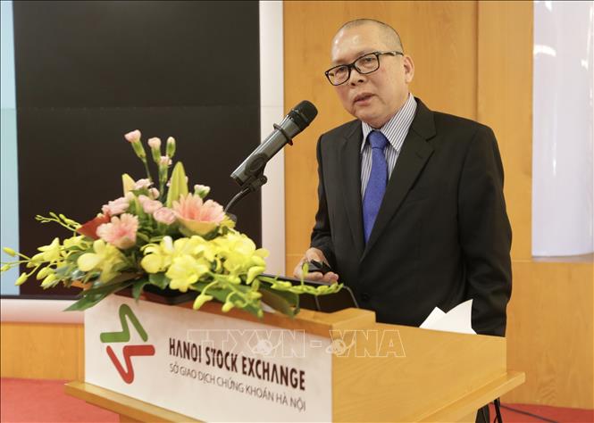 Trong ảnh: Ông Đàm Anh Tuấn, Thành viên Hội đồng quản trị Ngân hàng TMCP Á Châu (ACB) trình bày tham luận tại hội thảo. Ảnh: Trần Việt - TTXVN