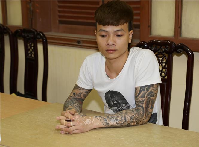 Trong ảnh: Đối tượng Ngô Bá Khá khi bị bắt. Ảnh: Thanh Thương - TTXVN