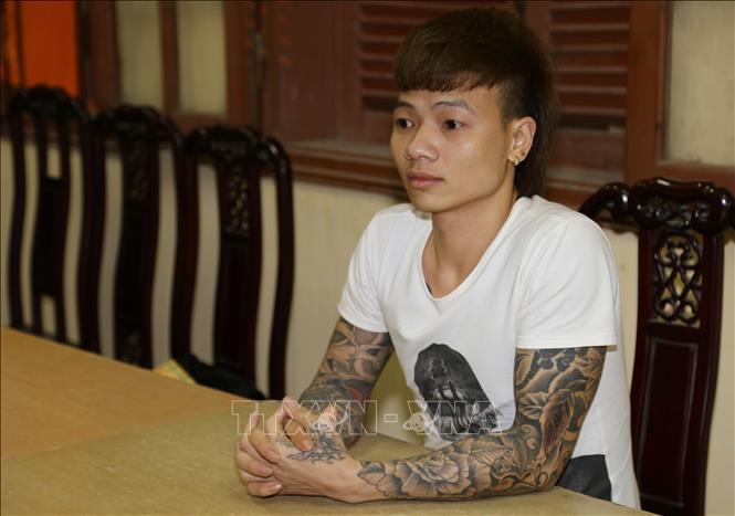 Trong ảnh: Đối tượng Ngô Bá Khá khi bị bắt. Ảnh: Thanh Thương - TTXVN