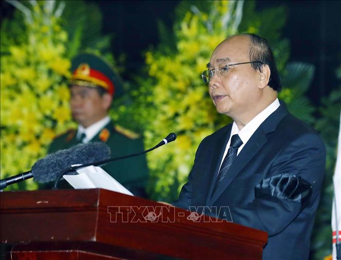 Trong ảnh: Thủ tướng Chính phủ Nguyễn Xuân Phúc, Trưởng Ban Lễ tang đọc điếu văn tại Lễ truy điệu Trung tướng Đồng Sỹ Nguyên. Ảnh: Thống Nhất – TTXVN
