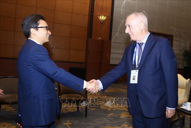 Trong ảnh: Phó Thủ tướng Vũ Đức Đam và Ngài Aslan Aslanov, Chủ tịch OANA, Tổng giám đốc Hãng thông tấn AZERTAC (Azerbaijan). Ảnh: Minh Quyết - TTXVN