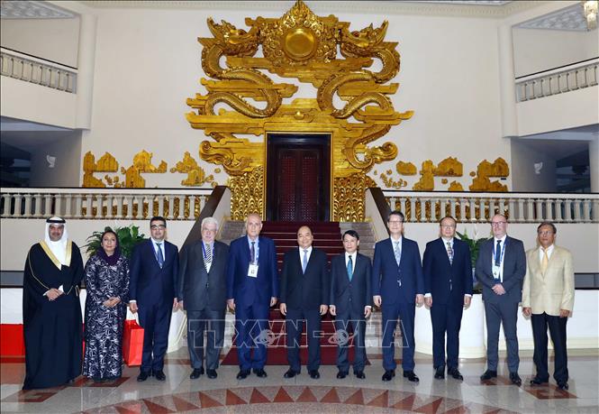 Trong ảnh: Thủ tướng Nguyễn Xuân Phúc và các Trưởng đoàn tại buổi tiếp. Ảnh: Thống Nhất –TTXVN