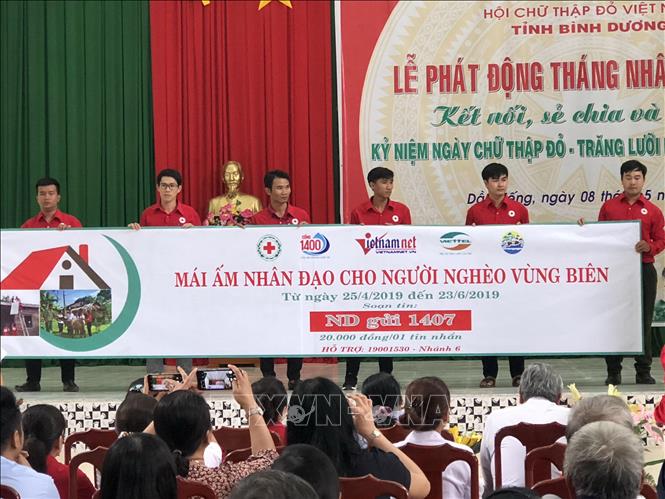 Quang cảnh lễ phát động ủng hộ và nhắn tin “Mái ấm nhân đạo cho người nghèo vùng biên”. Ảnh: Nguyễn Văn Việt-TTXVN