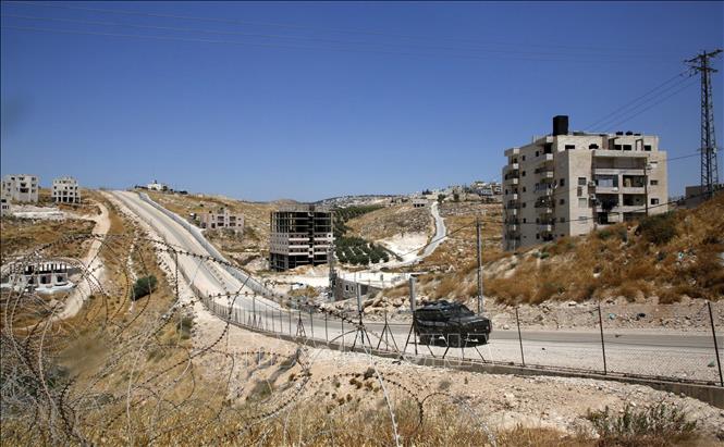 Trong ảnh: Những tòa nhà của người Palestine  tại thành phố Sur Baher , miền Đông Jerusalem, ngày 19/7. Ảnh: AFP/TTXVN
