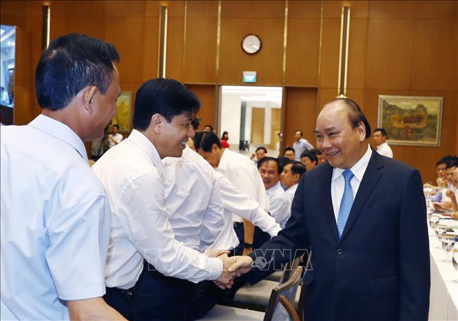Trong ảnh: Thủ tướng Nguyễn Xuân Phúc, Chủ tịch Uỷ ban Quốc gia Chính phủ điện tử và các đại biểu. Ảnh: Thống Nhất – TTXVN
