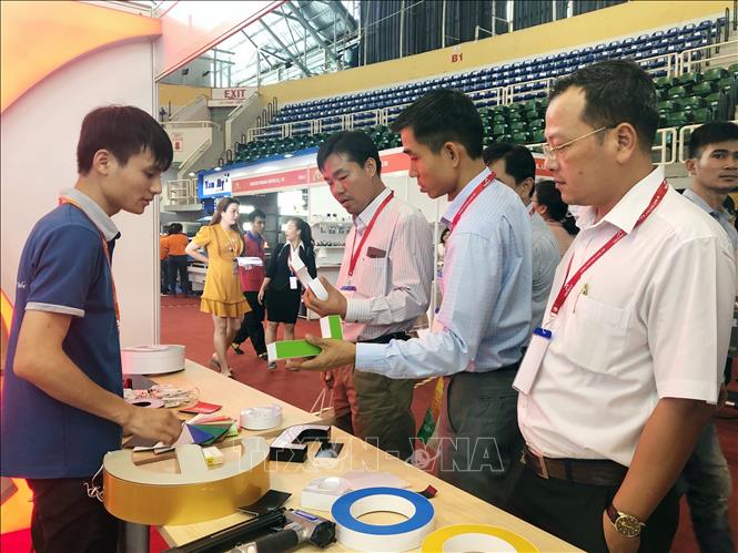 Photo: Visitors during the exhibition's opening day. VNA Photo: Mỹ Phương