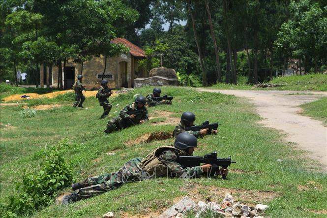 Trong ảnh: Chiến sĩ Lữ đoàn Hải quân đánh bộ 147 huấn luyện phản công đánh chiếm mục tiêu. Ảnh: Trọng Đức - TTXVN