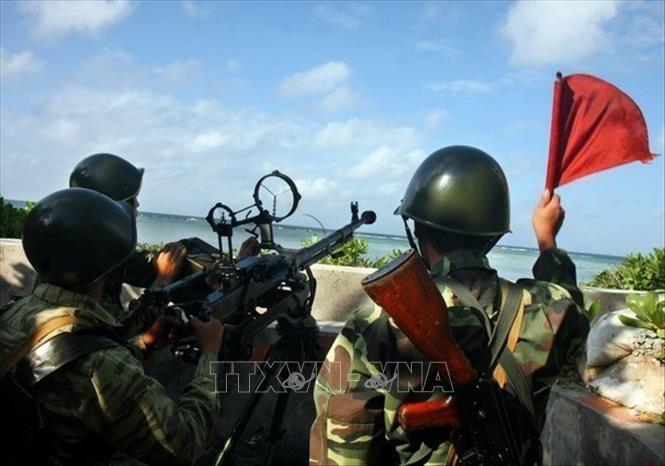 Trong ảnh: Chiến sỹ Hải quân khẩu đội súng máy phòng không 12,7 mm ngày đêm luyện tập, nâng cao cảnh giác, sẵn sàng chiến đấu bảo vệ quần đảo Trường Sa của Tổ quốc. Ảnh: Phương Hoa – TTXVN