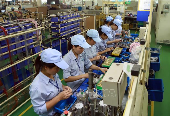 Trong ảnh: Hoạt động sản xuất tại Công ty TNHH Công nghiệp Minda Việt Nam (khu công nghiệp Bình Xuyên). Ảnh: Hoàng Hùng - TTXVN
