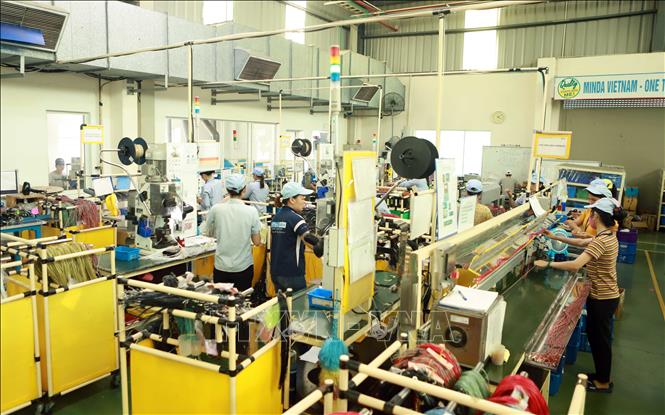 Trong ảnh: Hoạt động sản xuất tại Công ty TNHH Công nghiệp Minda Việt Nam (khu công nghiệp Bình Xuyên). Ảnh : Hoàng Hùng - TTXVN