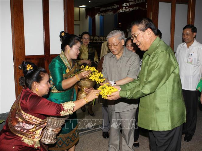 Trong ảnh: Tổng Bí thư Nguyễn Phú Trọng thăm và chúc Tết cổ truyền Bunpimay của CHDCND Lào (ngày 12/4/2014). Ảnh: Trí Dũng – TTXVN