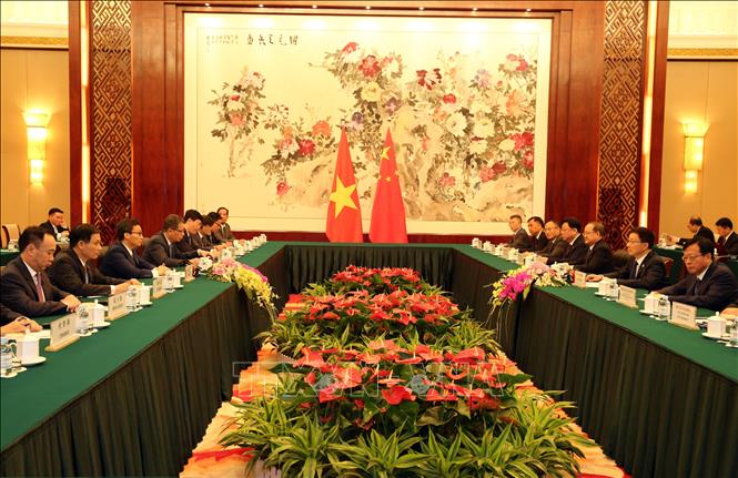 Trong ảnh: Phó Thủ tướng Chính phủ Vũ Đức Đam hội đàm với Ủy viên Thường vụ Bộ Chính trị, Phó Thủ tướng Quốc vụ viện Trung Quốc Hàn Chính.  Ảnh: Lương Anh Tuấn-Pv TTXVN tại Trung Quốc 