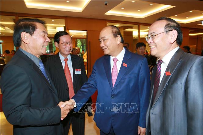 Trong ảnh: Thủ tướng Nguyễn Xuân Phúc với các đại biểu. Ảnh: Doãn Tấn - TTXVN