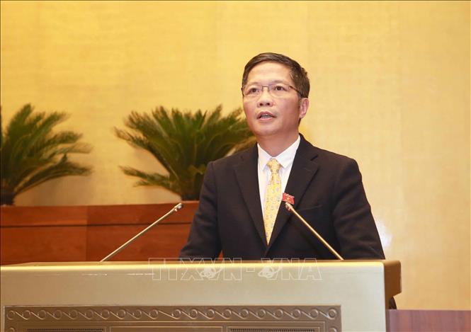 Trong ảnh: Bộ trưởng Bộ Công Thương Trần Tuấn Anh báo cáo trước Quốc hội. Ảnh: Doãn Tấn - TTXVN