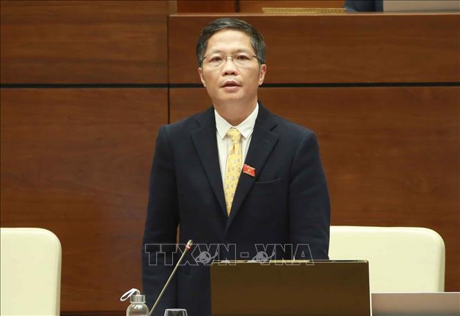 Trong ảnh: Bộ trưởng Bộ Công Thương Trần Tuấn Anh trả lời chất vấn. Ảnh: Doãn Tấn - TTXVN